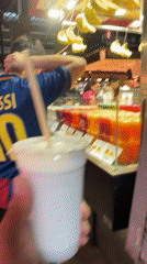Barcelona market scene features person in Messi jersey