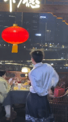 Traditional tea ceremonies and costumed tourists at Chongqing landmark