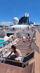 Woman relaxes on cruise ship deck in Marseille