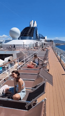 Woman relaxes on cruise ship deck in Marseille