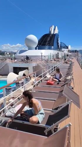 Woman relaxes on cruise ship deck in Marseille
