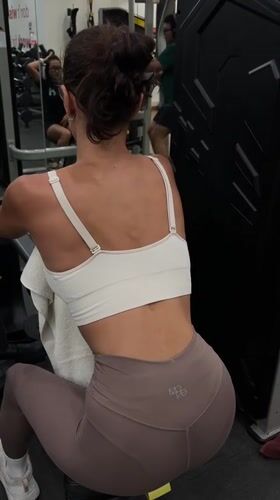Woman exercises on rowing machine at Denpasar gym