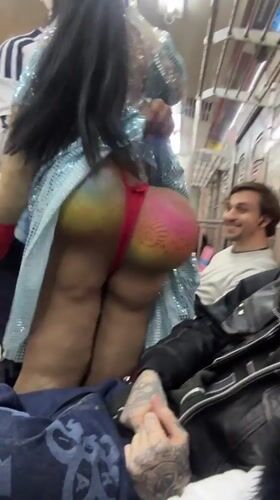 Costumed dancer and tattooed passenger ride Buenos Aires transit