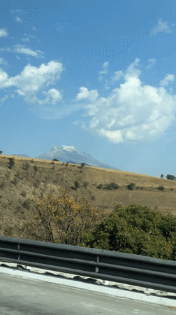 Traveler films snow-capped mountain vista in San Marcos Huixtoco