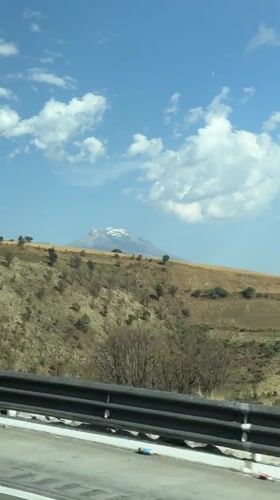 Traveler films snow-capped mountain vista in San Marcos Huixtoco