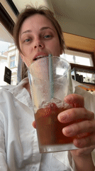 Woman enjoys morning cafe visit in Karlovy Vary