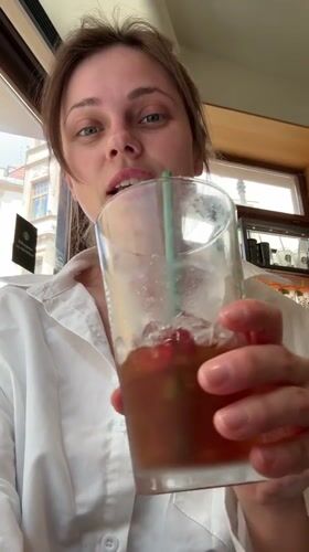 Woman enjoys morning cafe visit in Karlovy Vary