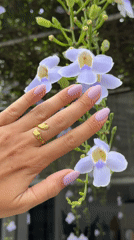 Hand jewelry and carpenter bee captured among flowers, North Kuta