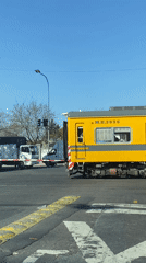 Línea Urquiza train crosses Buenos Aires road intersection