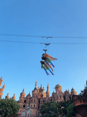 Aerial performers and festival crowds at Baqiao's castle grounds