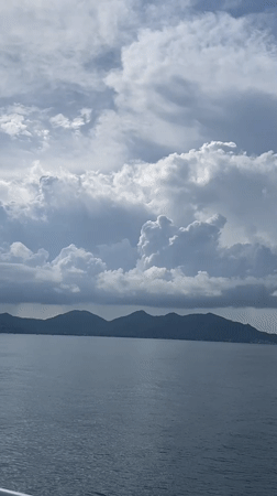 Person enjoys ocean view from boat near Ko Tao