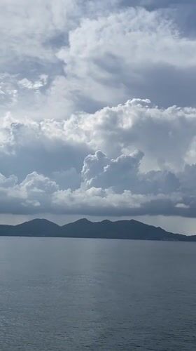 Person enjoys ocean view from boat near Ko Tao
