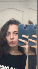 Woman takes mirror selfies with multi-lens smartphone over three minutes