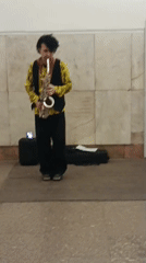 Saxophonist performs in indoor public space Tuesday evening