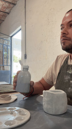 Artist works with ceramics and liquids in Mexico studio
