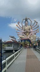 Morning visit to ornate Thai temple with multi-armed deity statue