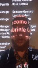 Projected names wash across a face in Saint Petersburg