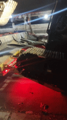 SANY excavator loaded onto flatbed at night in Indonesia