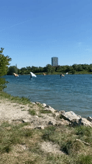 Water sports enthusiasts enjoy sunny afternoon at Vienna lake