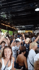 Soccer crowds and surf sessions across a Kuta night and morning