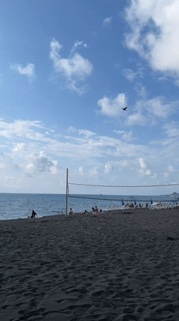 Busy afternoon on Ureki's black sand beach, Georgia