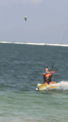 Kitesurfers catch air off the Denpasar coast on a clear morning