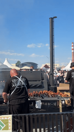 Outdoor festival with food vendors, rides, fountain in Yekaterinburg