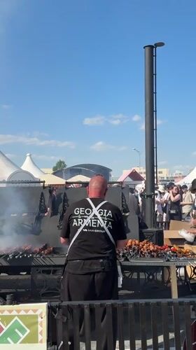 Outdoor festival with food vendors, rides, fountain in Yekaterinburg