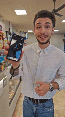 Young man uses contactless payment at Corsico store