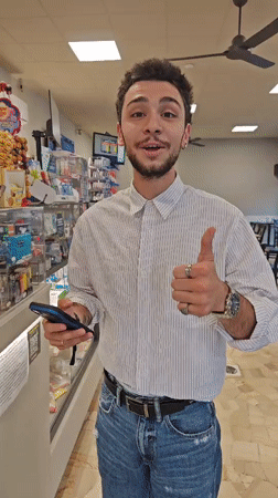 Young man uses contactless payment at Corsico store