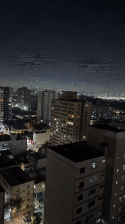 Nighttime aerial footage captures São Paulo's illuminated cityscape