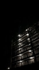 Nighttime moon and residential buildings observed in Yuzhong District