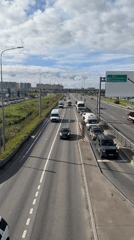 On and around Saint Petersburg's orange cable bridge, morning traffic below