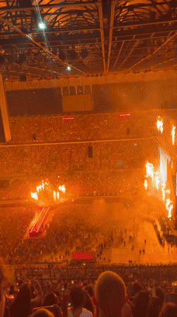 Stadium concert lights up Milan in red