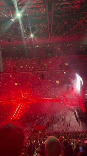 Stadium concert lights up Milan in red