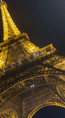 Eiffel Tower captured in golden nighttime illumination