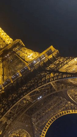 Eiffel Tower captured in golden nighttime illumination