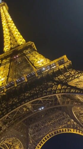 Eiffel Tower captured in golden nighttime illumination