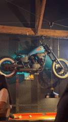 Belgrade bar features motorcycle wall decor, foreign currency display