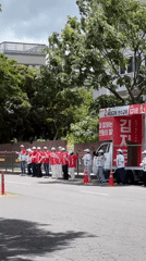Political campaign with uniformed supporters observed in Jeju