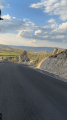 Tourist captures fairy chimney landscapes in Göreme, Turkey