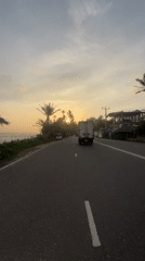 Truck travels marked road in Ahangama, Sri Lanka