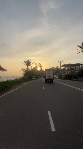 Truck travels marked road in Ahangama, Sri Lanka