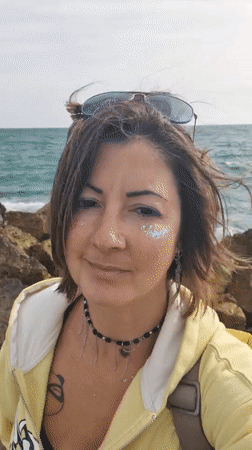 Woman photographed at Jordan beach during afternoon visit