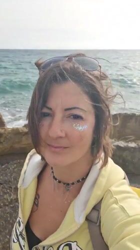 Woman photographed at Jordan beach during afternoon visit