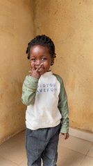 Child photographed in playful moments in Kuru Dungus, Nigeria