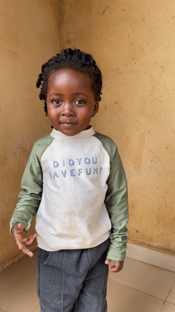 Child photographed in playful moments in Kuru Dungus, Nigeria