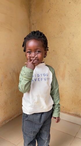 Child photographed in playful moments in Kuru Dungus, Nigeria