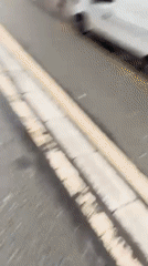 Woman takes bicycle selfie near Paris shopping district