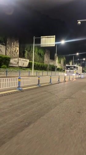 Street sweeper operates on wet roads in Chongqing district